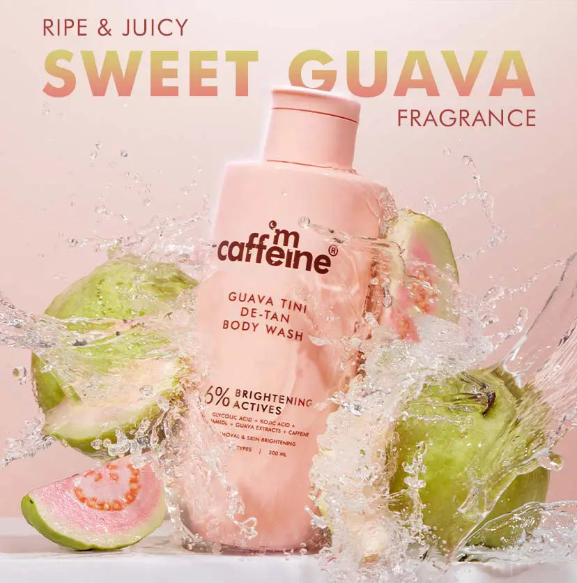 mCaffeine Guava Tini De-Tan Body Wash 300 ml - sweet guava fragrance visual with the bottle in a water splash beside fresh guavas