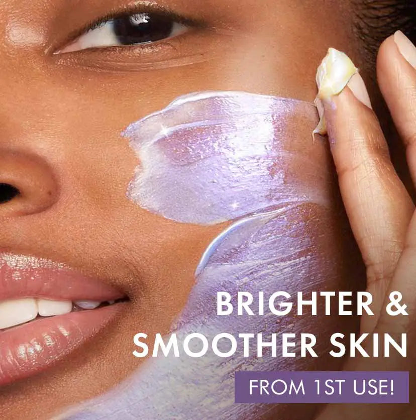 mCaffeine Super Glow Flash Facial Mask 50 gm - model applying the pearlised mask across her cheek