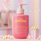 mCaffeine Sweet Escape Perfume Body Lotion 300 ml - niacinamide, cocoa butter and caffeine - pink pump bottle beside a popcorn tub